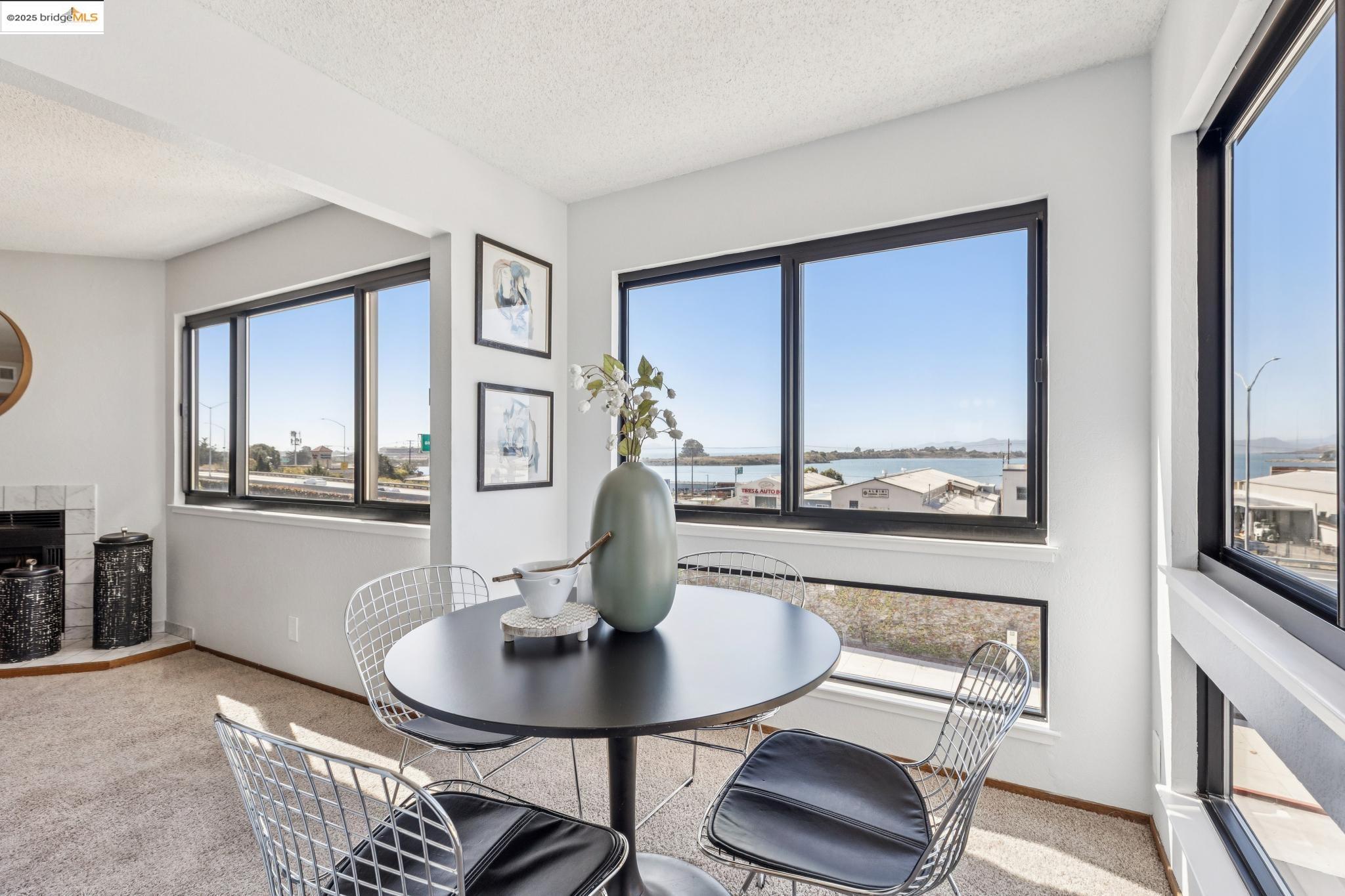 545 Pierce Street, Unit 1206 Albany, CA 94706 - Photo 11 of 44 a view of a dining room with furniture window and wooden floor