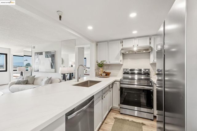 a bedroom with a bed and a tv