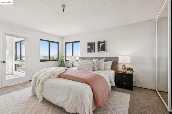 a bedroom with a bed and a table in it