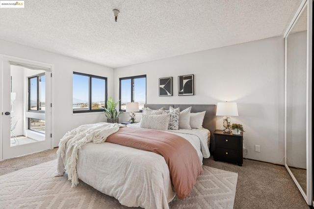 a bedroom with a bed and a table in it