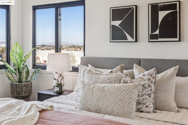 a vase of flowers sitting on a table with wooden floor