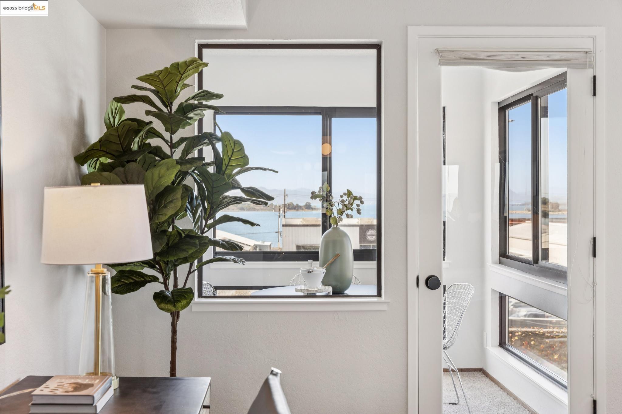 545 Pierce Street, Unit 1206 Albany, CA 94706 - Photo 24 of 44 a vase of flowers sitting on a table with wooden floor