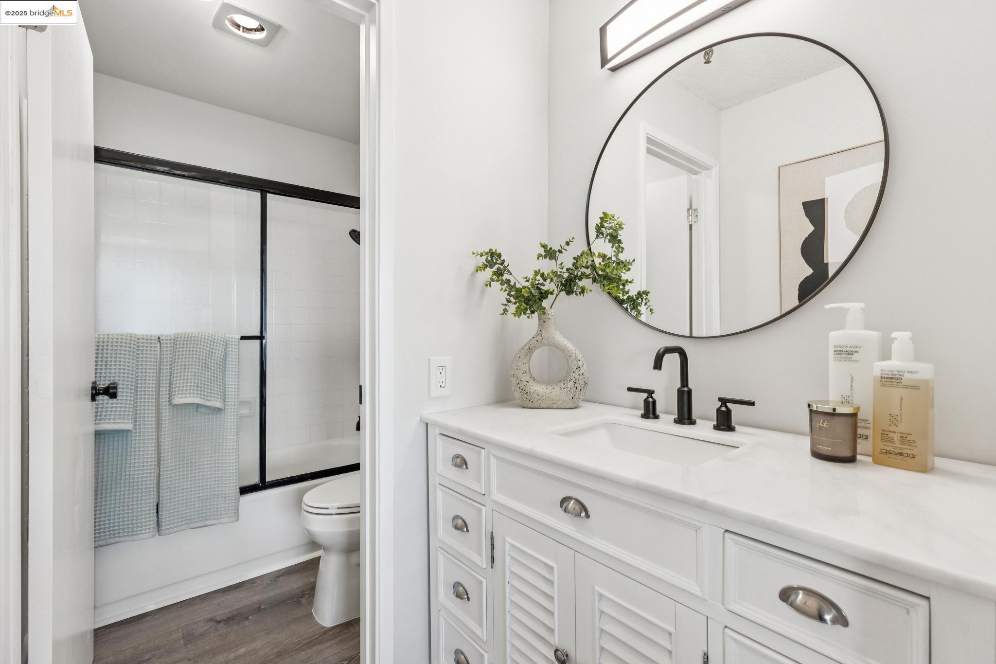 545 Pierce Street, Unit 1206 Albany, CA 94706 - Photo 34 of 44 a bathroom with a sink a toilet and a mirror