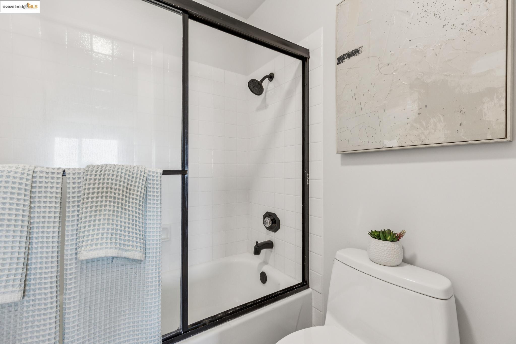 545 Pierce Street, Unit 1206 Albany, CA 94706 - Photo 35 of 44 a bathroom with a shower a toilet and a sink