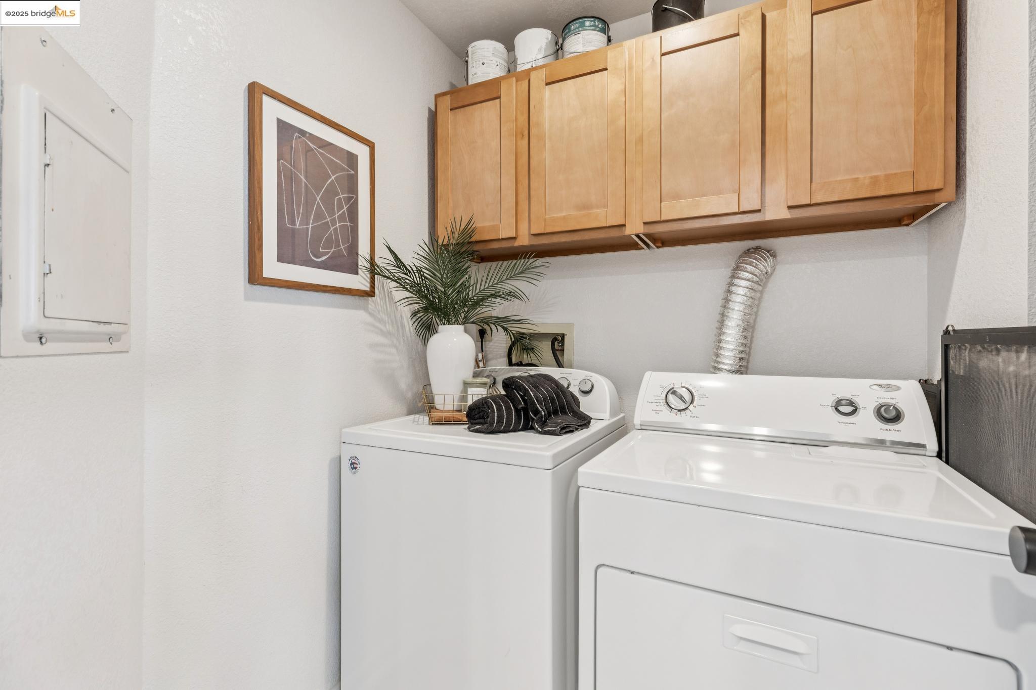 545 Pierce Street, Unit 1206 Albany, CA 94706 - Photo 36 of 44 a view of storage and utility room with washer and dryer