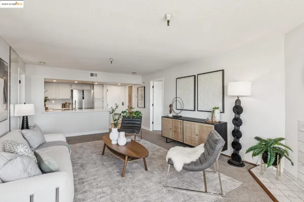 a view of a dining room with furniture large window and outside view