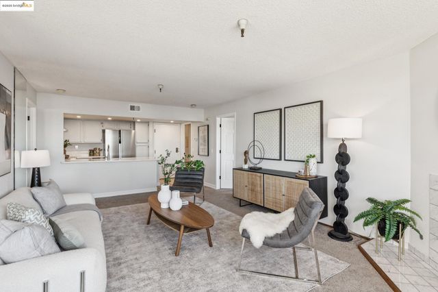 a view of a dining room with furniture large window and outside view