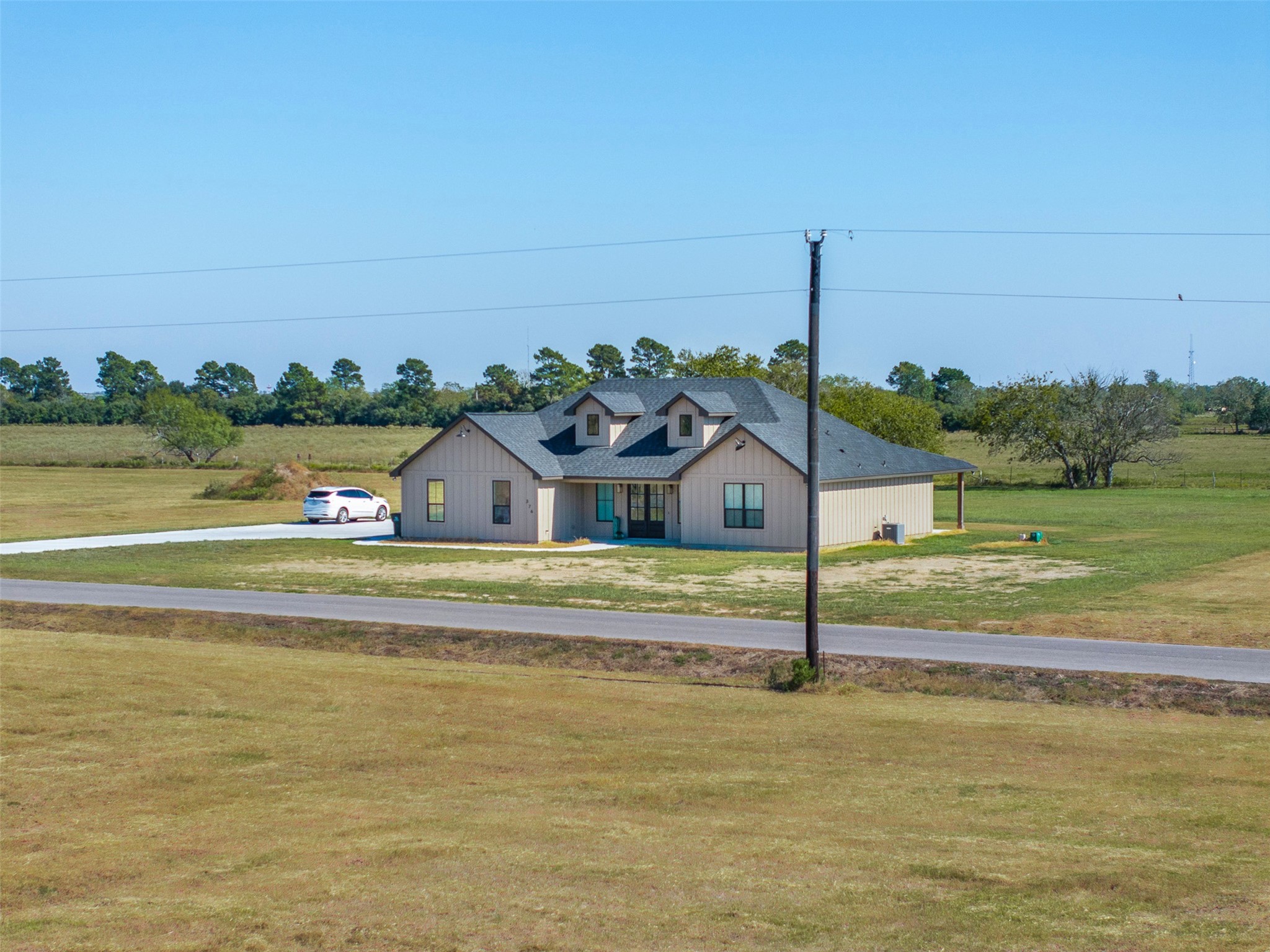423 Ridgeview Drive Cat Spring, TX 78933 - Photo 16 of 30 a view of a house with a yard and lake view