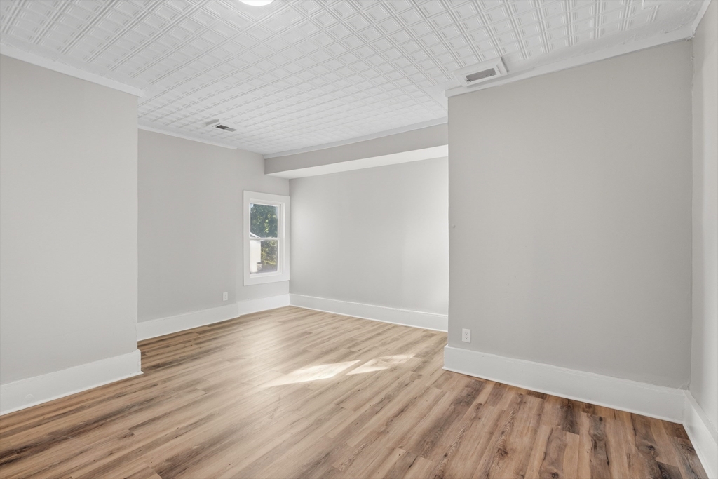 834 Worthington Street, Unit 2 Springfield, MA 01105 - Photo 3 of 20 a view of an empty room with wooden floor