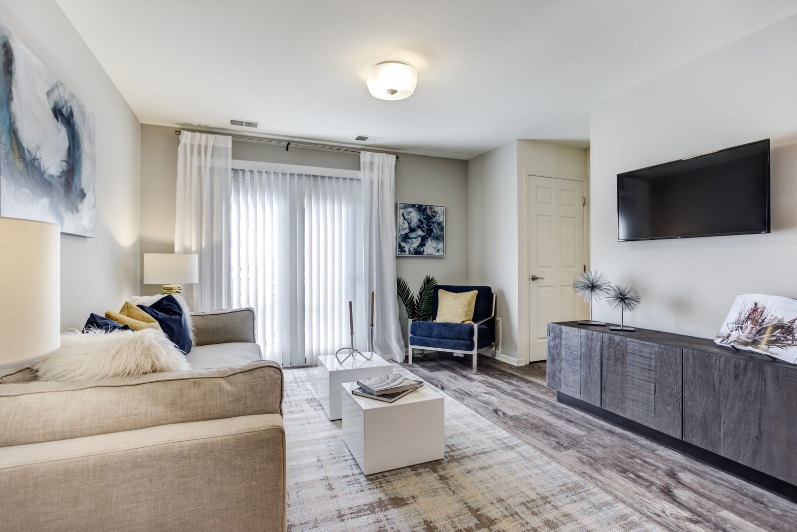 304 Sibelius Court, Unit 304 Wheaton, IL 60189 - Photo 25 of 60 a living room with furniture and a flat screen tv
