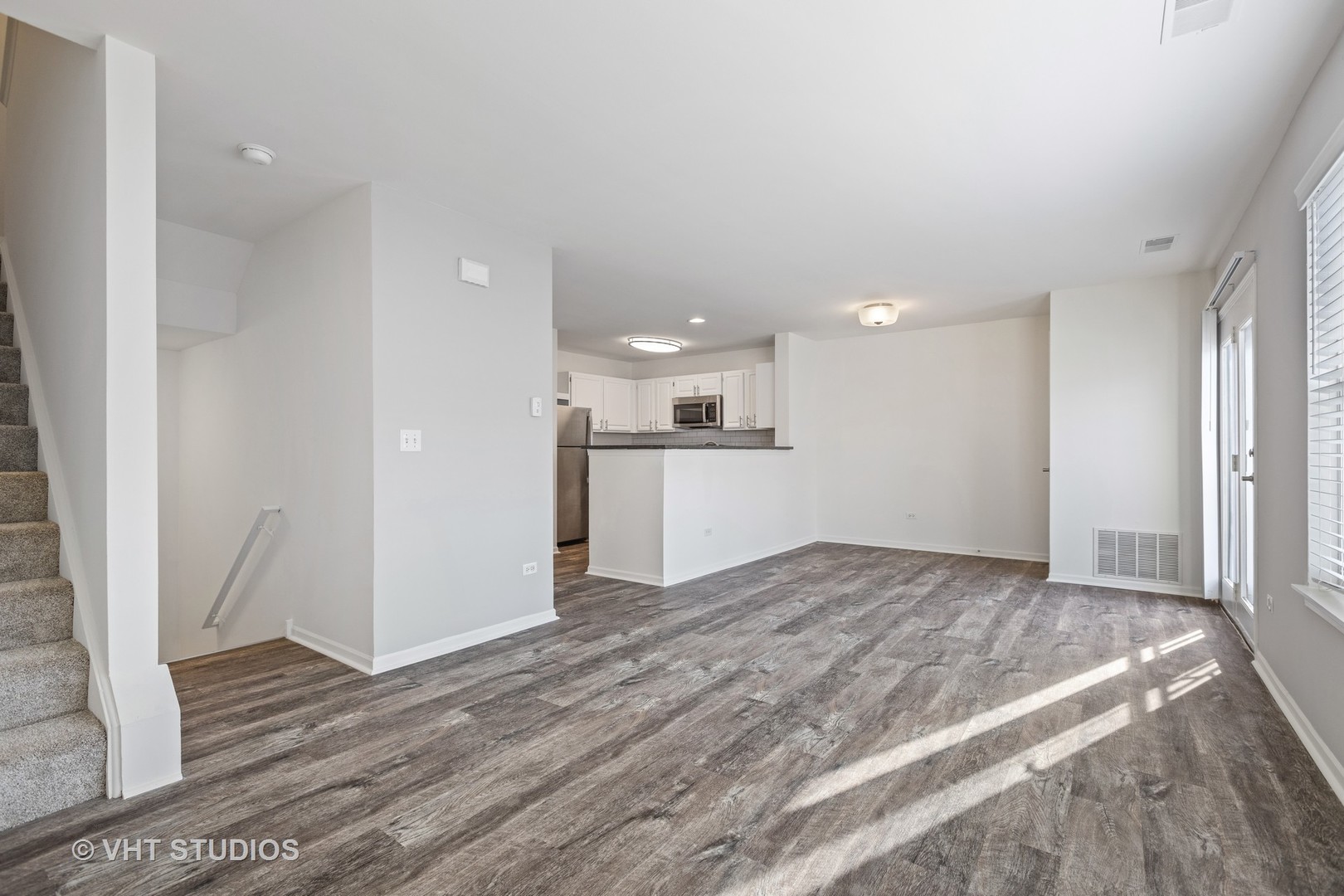 304 Sibelius Court, Unit 304 Wheaton, IL 60189 - Photo 52 of 60 a view of a kitchen with a sink and wooden floor