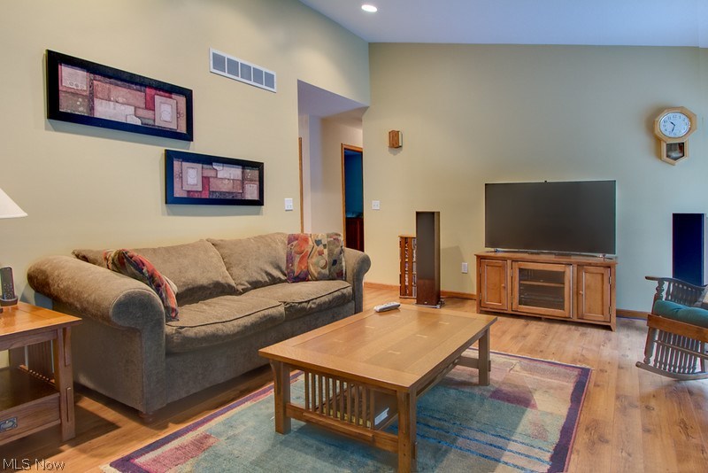 4675 Richman Road Litchfield, OH 44253 - Photo 3 of 30 The spacious family room has a vaulted ceiling, recessed lighting and laminate flooring.