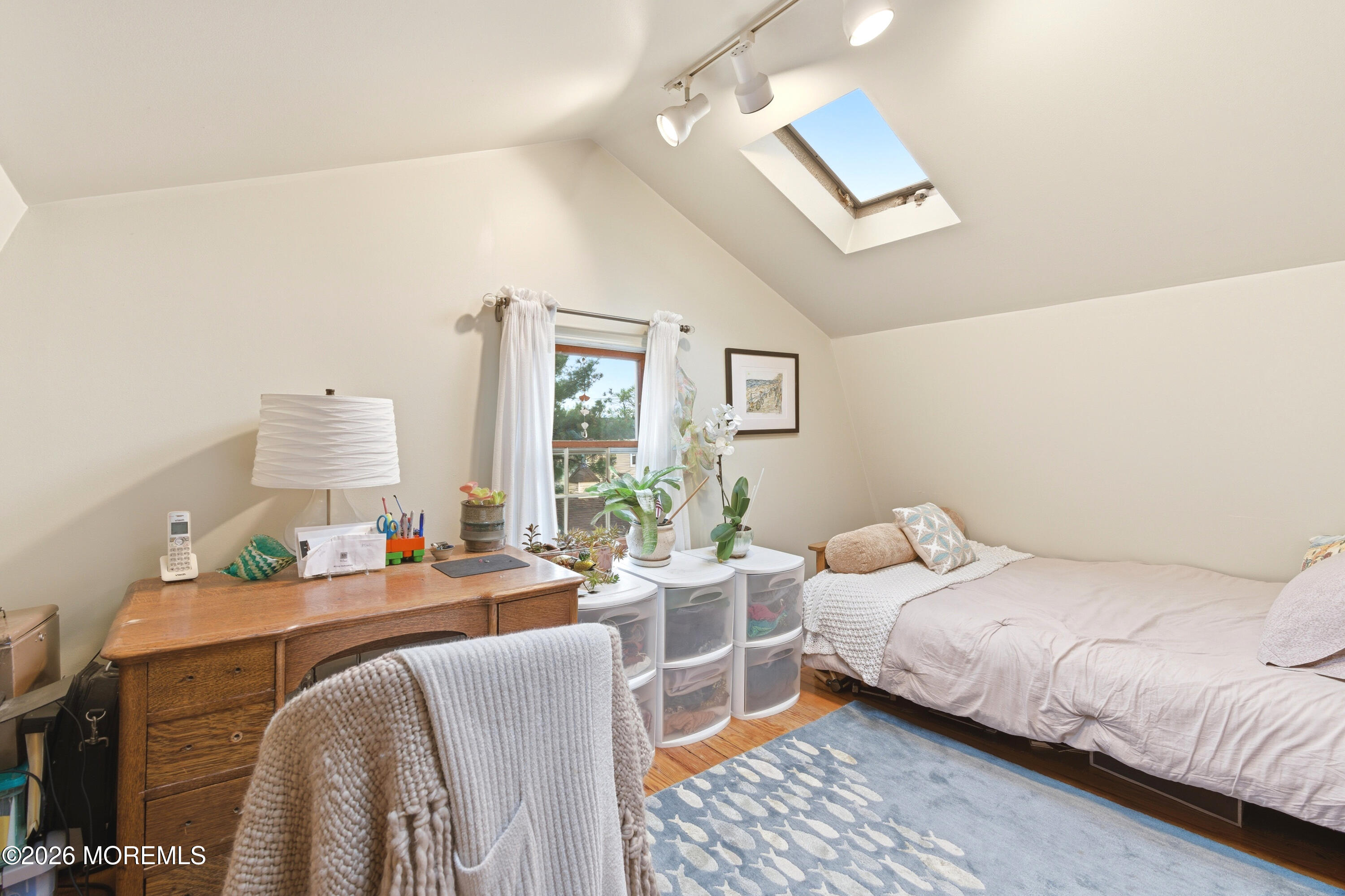 114 Ocean Boulevard Keyport, NJ 07735 - Photo 20 of 41 a bedroom with furniture and a large window
