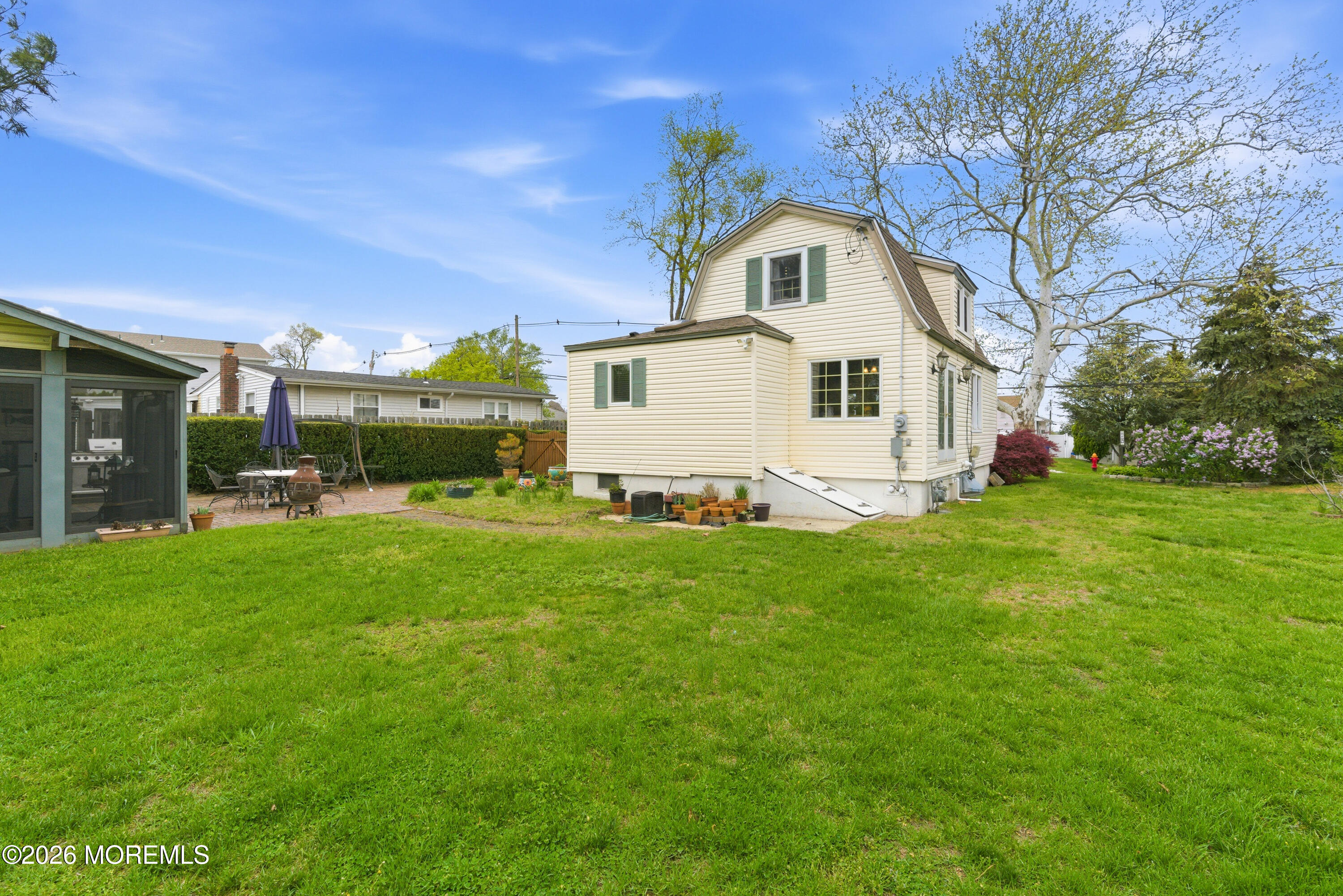114 Ocean Boulevard Keyport, NJ 07735 - Photo 27 of 41 a front view of house with yard and green space