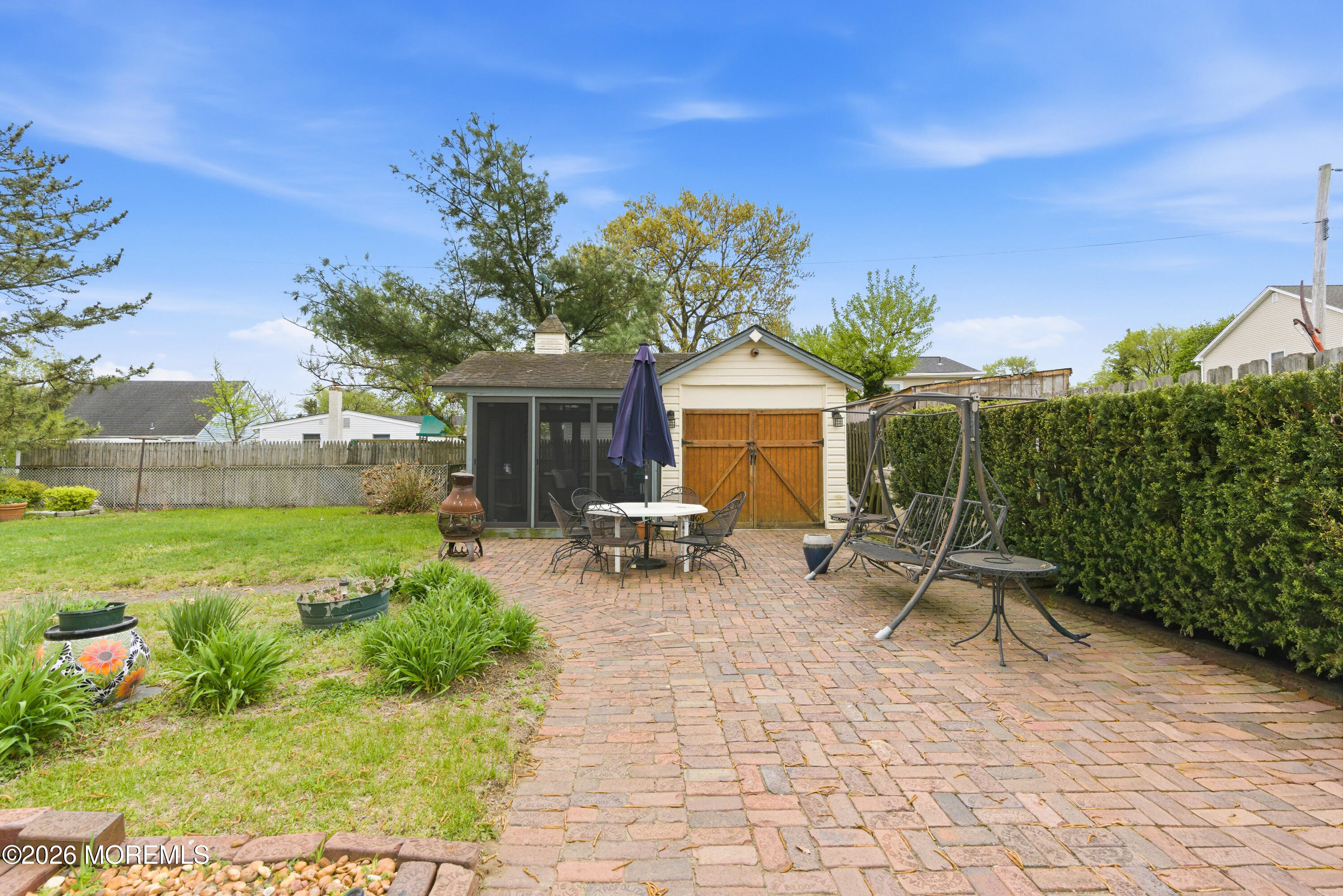 114 Ocean Boulevard Keyport, NJ 07735 - Photo 30 of 41 a view of a chair and tables in the garden