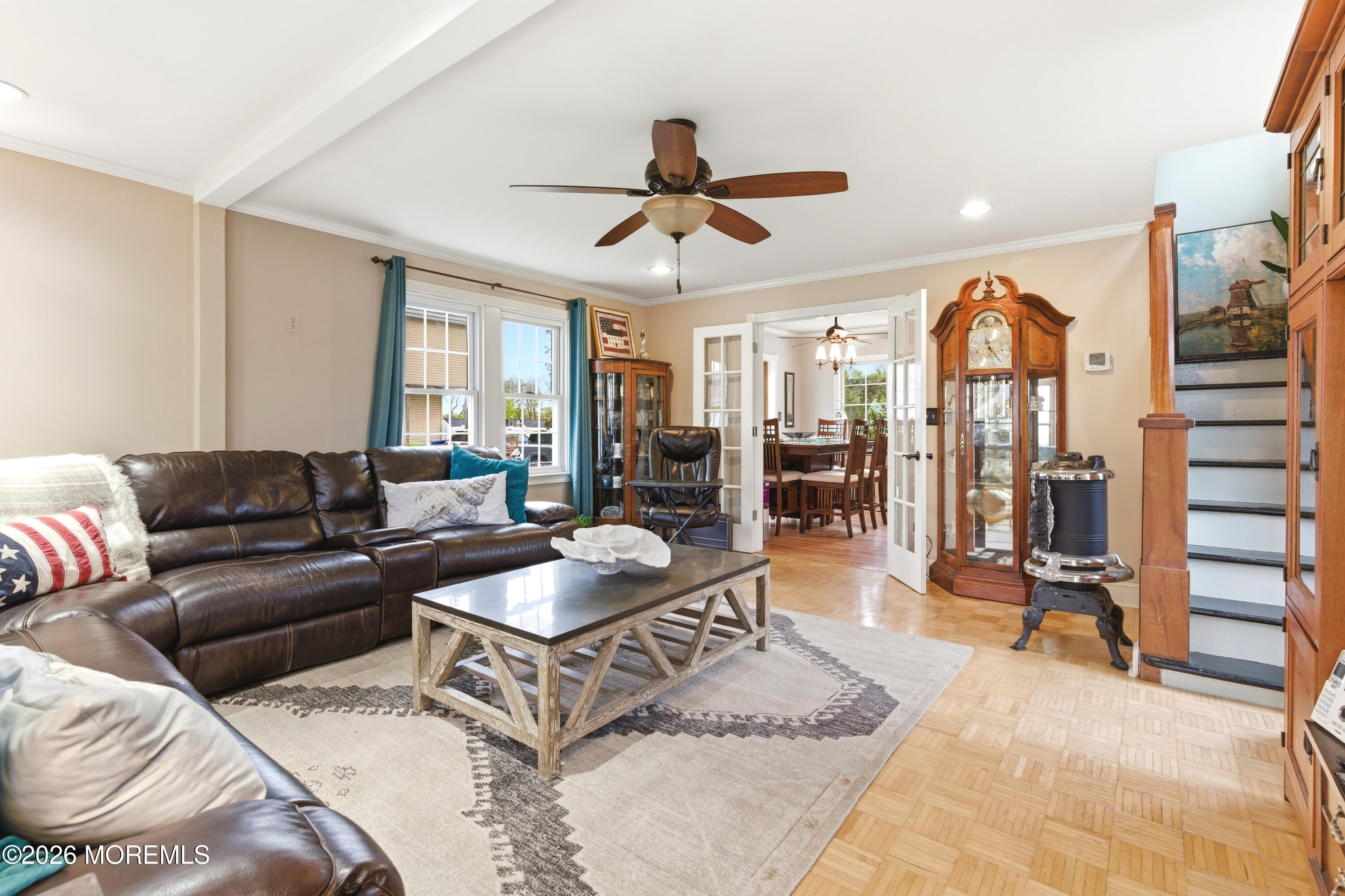 114 Ocean Boulevard Keyport, NJ 07735 - Photo 5 of 41 a living room with furniture a chandelier and a rug