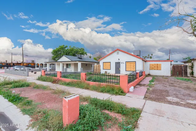 a front view of house with yard and trees