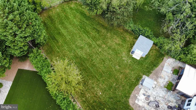 a view of a patio with couches table and chairs and potted plants