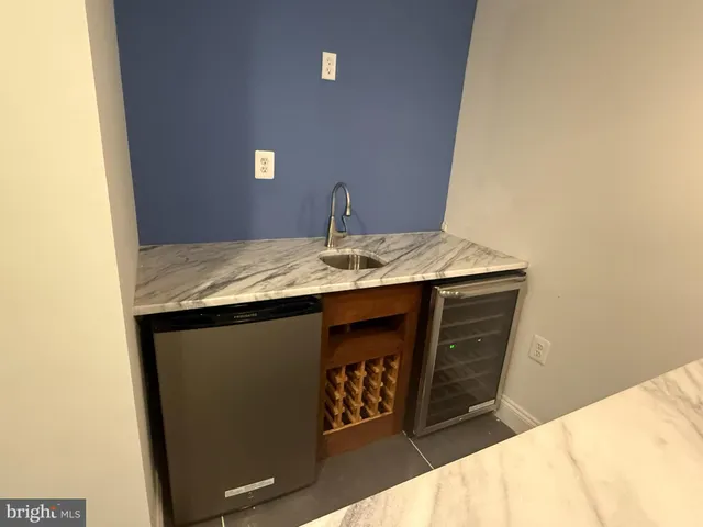 a view of an empty room with empty shelves