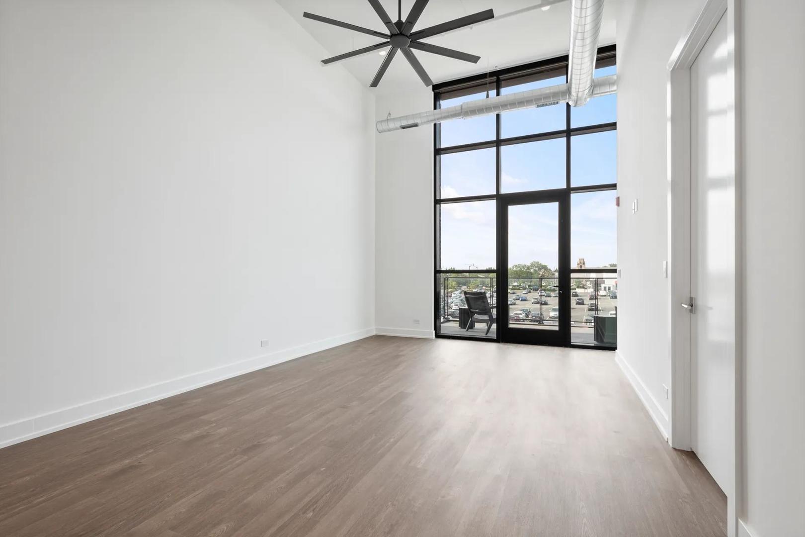 728 Waukegan Road, Unit 206 Deerfield, IL 60015 - Photo 14 of 18 wooden floor in an empty room with a window