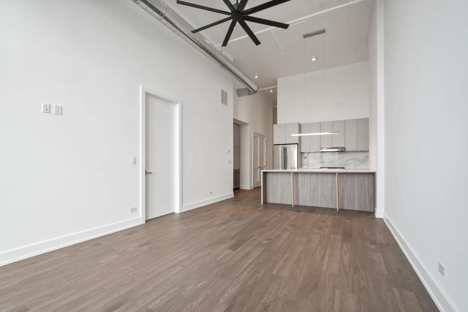 728 Waukegan Road, Unit 206 Deerfield, IL 60015 - Photo 5 of 18 a view of kitchen with wooden floor and electronic appliances