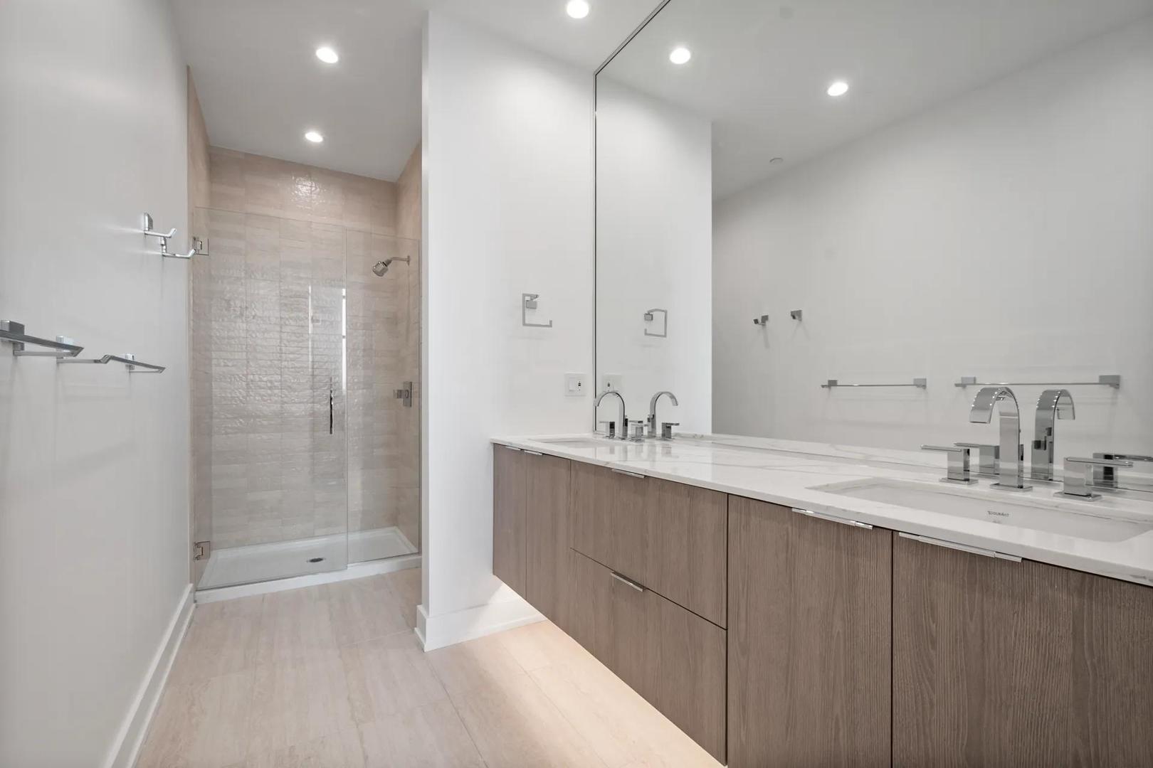728 Waukegan Road, Unit 206 Deerfield, IL 60015 - Photo 6 of 18 a bathroom with a double vanity sink mirror double and shower