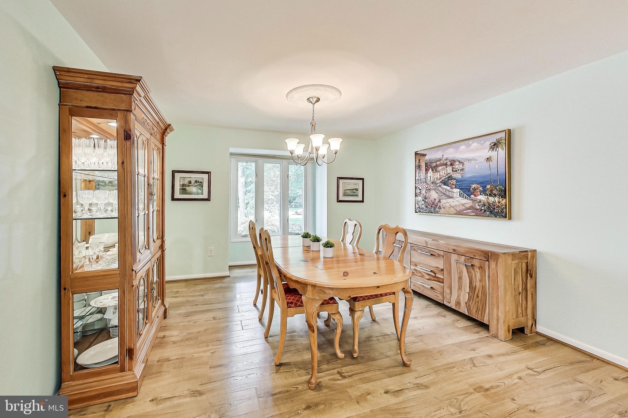 2452 Freetown Drive Reston, VA 20191 - Photo 9 of 69 Formal Dining Room with Laminate Plank Flooring