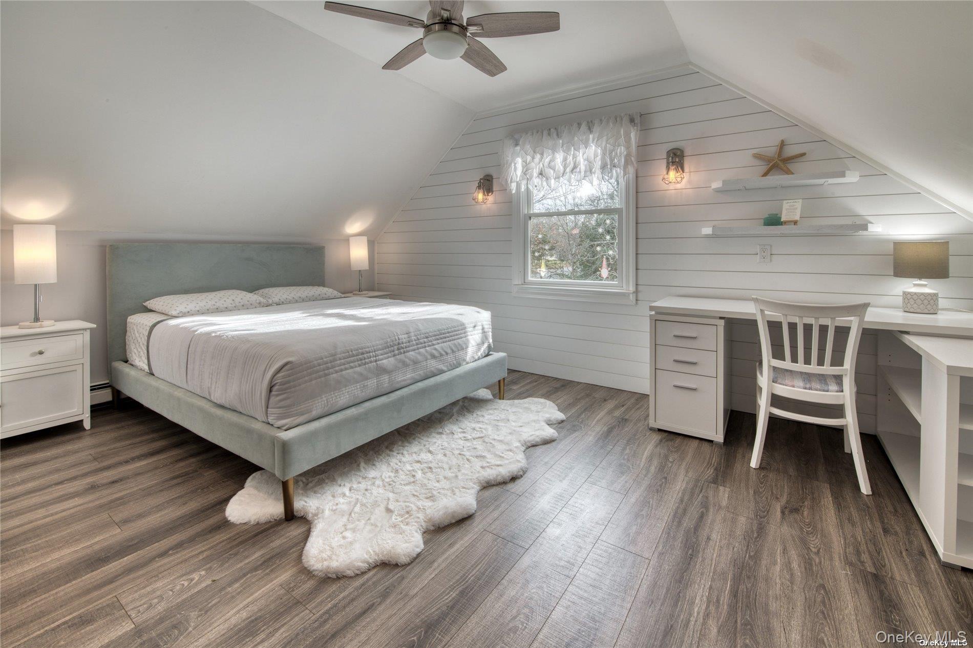 114 Spinney Road East Quogue, NY 11942 - Photo 12 of 15 a bedroom with a bed and a table