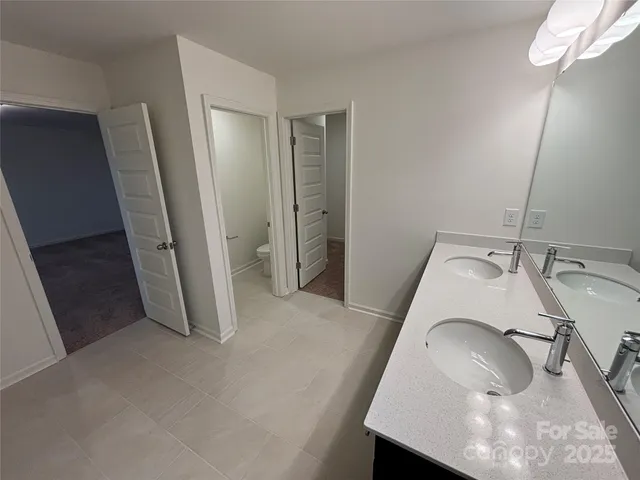 a view of a livingroom with wooden floor and staircase