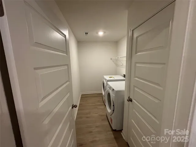 a view of a storage & utility room with washer and dryer