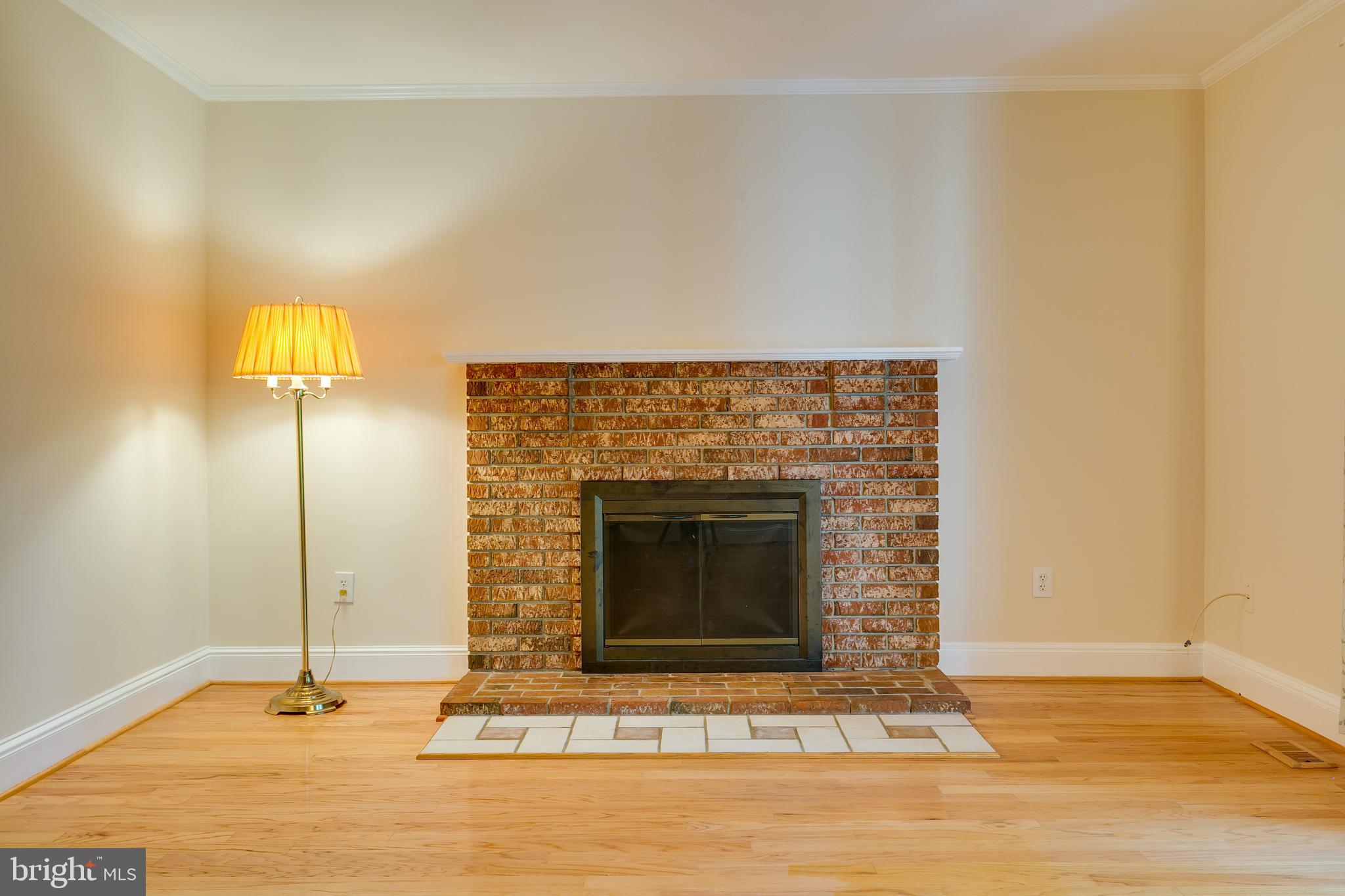 7007 Barnacle Place Burke, VA 22015 - Photo 12 of 49 a living room with a fireplace