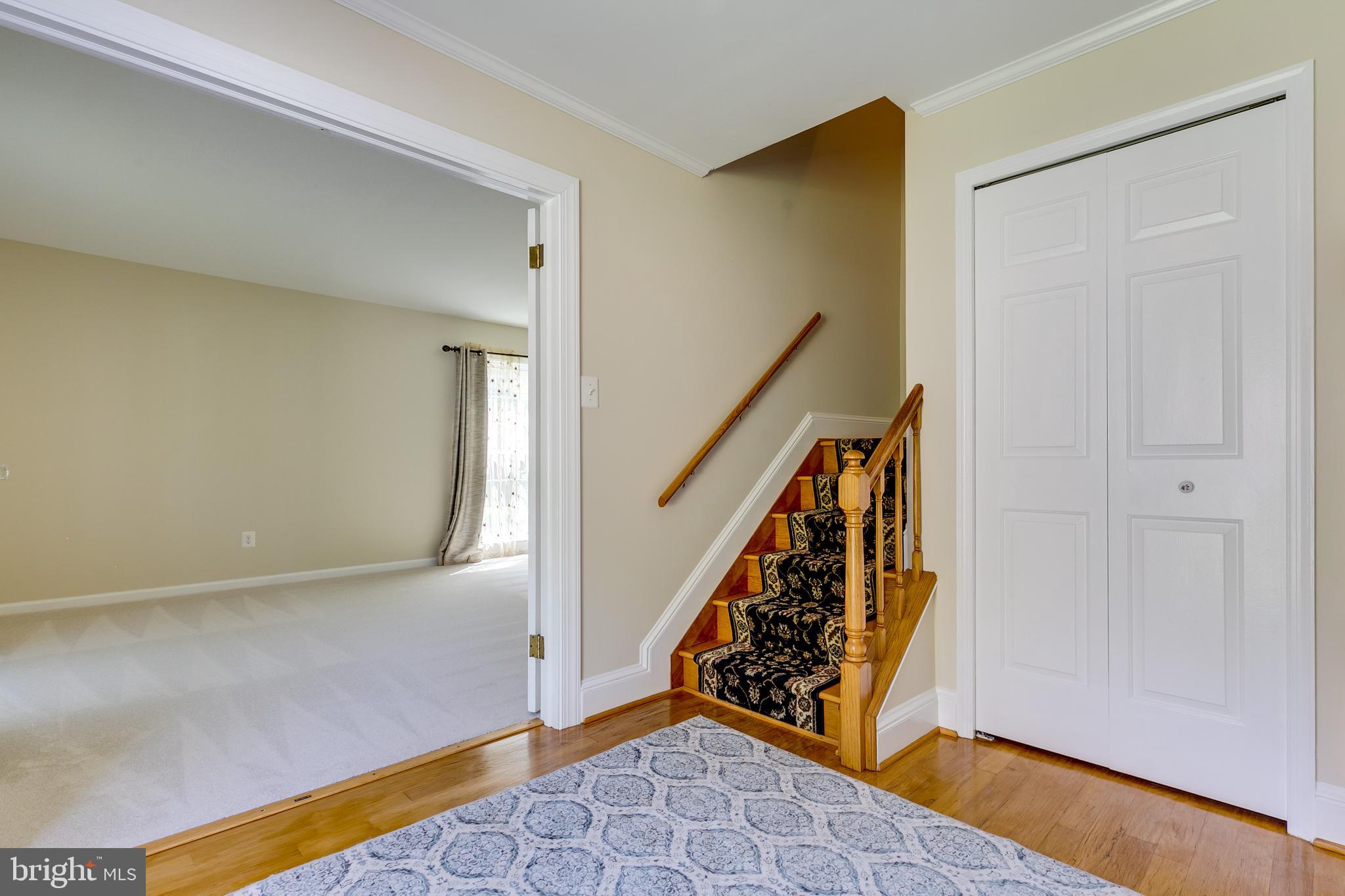 7007 Barnacle Place Burke, VA 22015 - Photo 21 of 49 a view of an entryway with staircase
