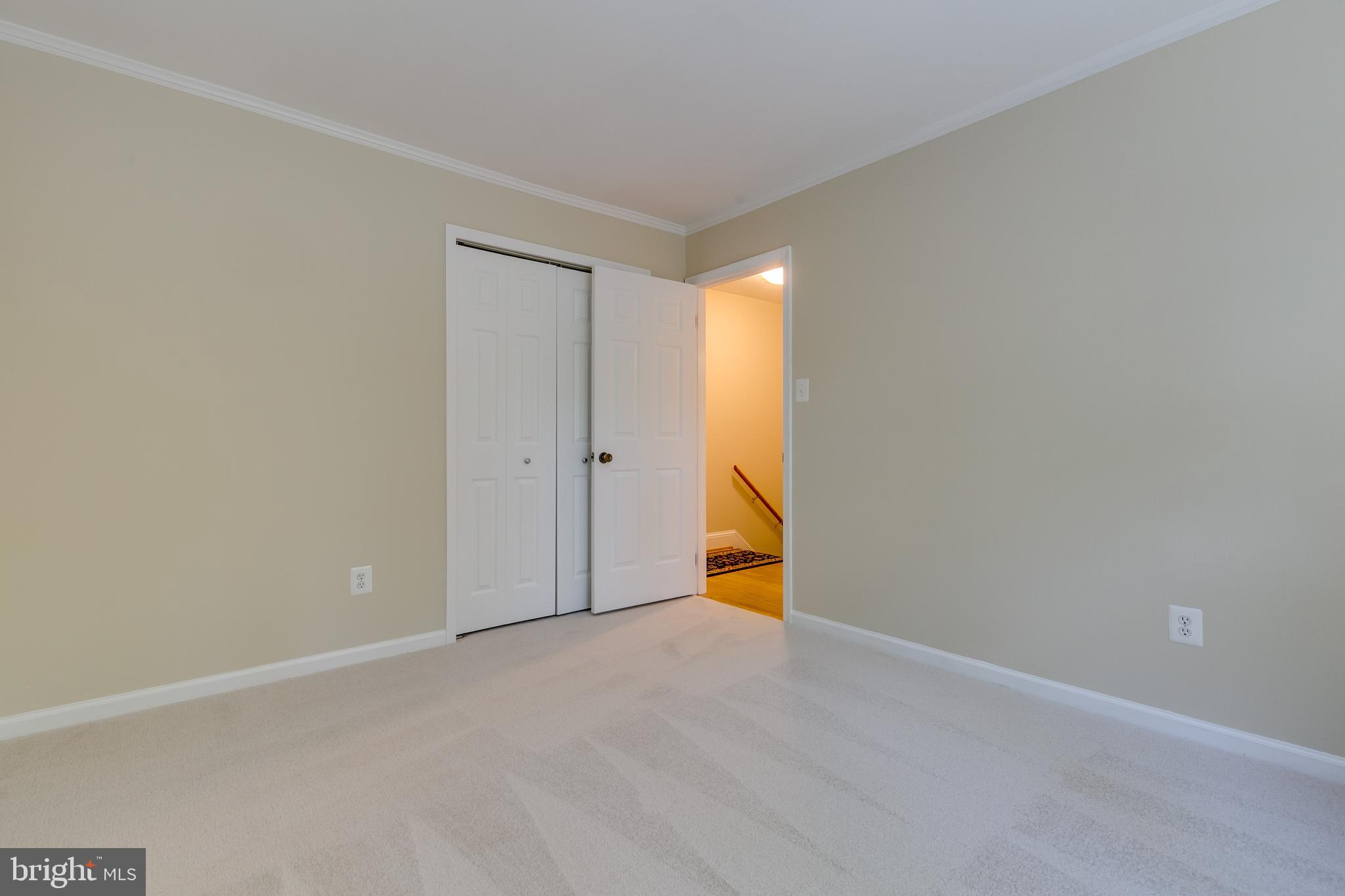 7007 Barnacle Place Burke, VA 22015 - Photo 22 of 49 a view of a room with yellow walls