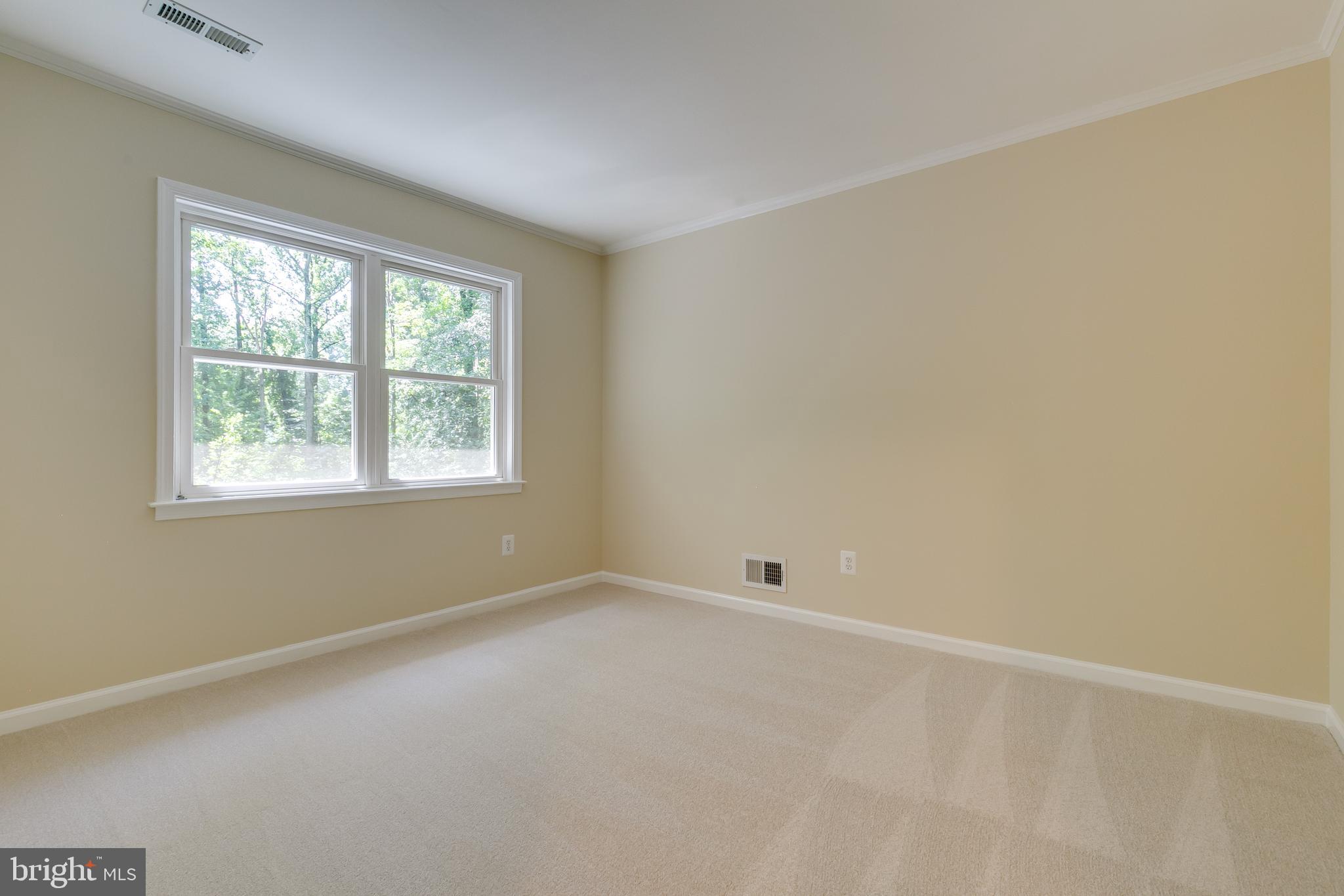 7007 Barnacle Place Burke, VA 22015 - Photo 23 of 49 an empty room with a window