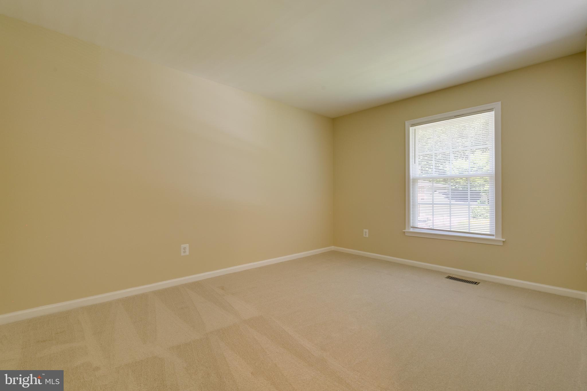 7007 Barnacle Place Burke, VA 22015 - Photo 24 of 49 a view of an empty room with a window