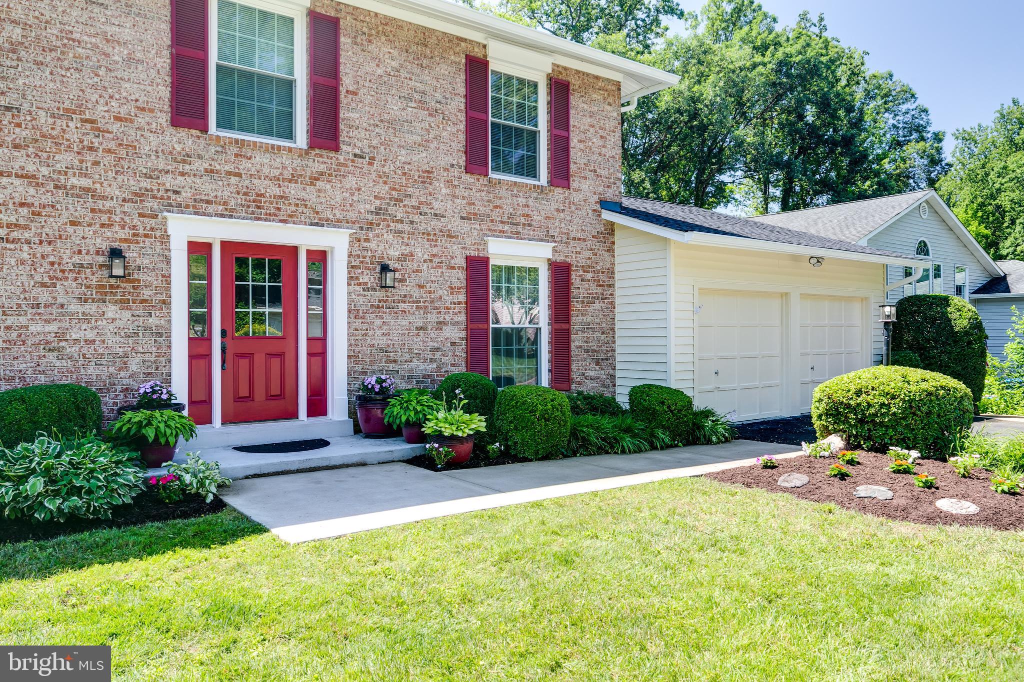 7007 Barnacle Place Burke, VA 22015 - Photo 3 of 49 a front view of a house with a yard