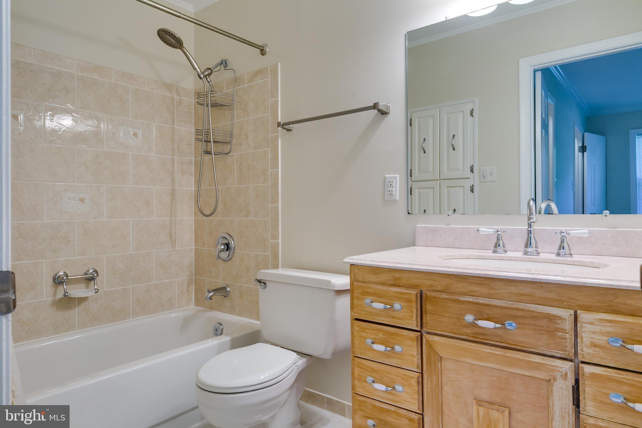 7007 Barnacle Place Burke, VA 22015 - Photo 32 of 49 a bathroom with a sink a toilet and a bathtub