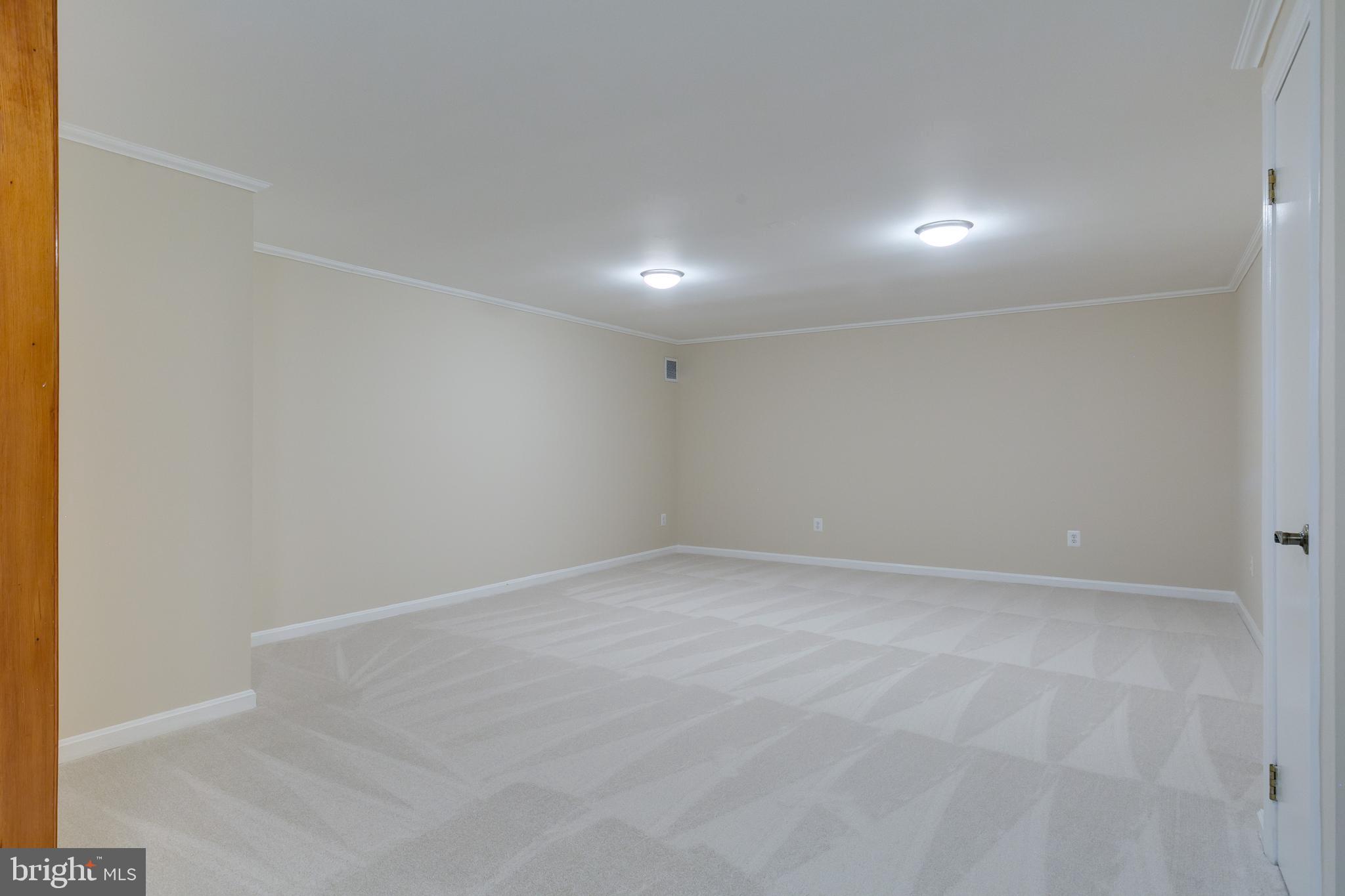 7007 Barnacle Place Burke, VA 22015 - Photo 34 of 49 a view of an empty room