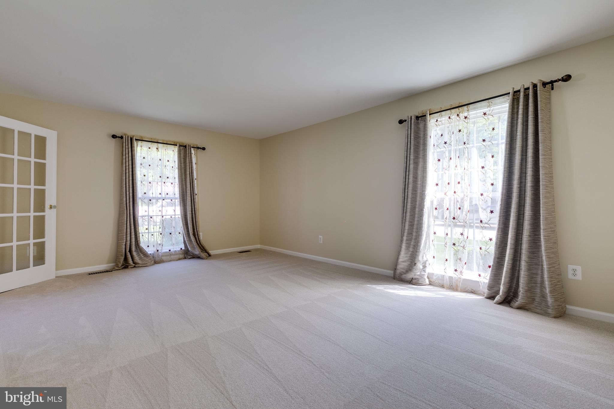 7007 Barnacle Place Burke, VA 22015 - Photo 5 of 49 an empty room with windows