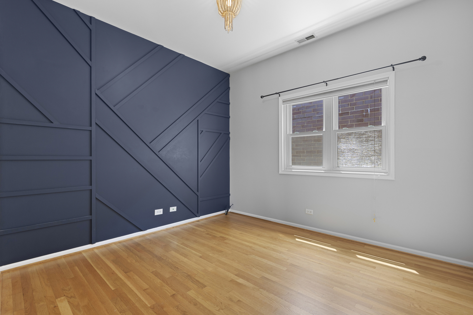 1267 North Honore Street, Unit 3 Chicago, IL 60622 - Photo 8 of 17 a view of an empty room with wooden floor