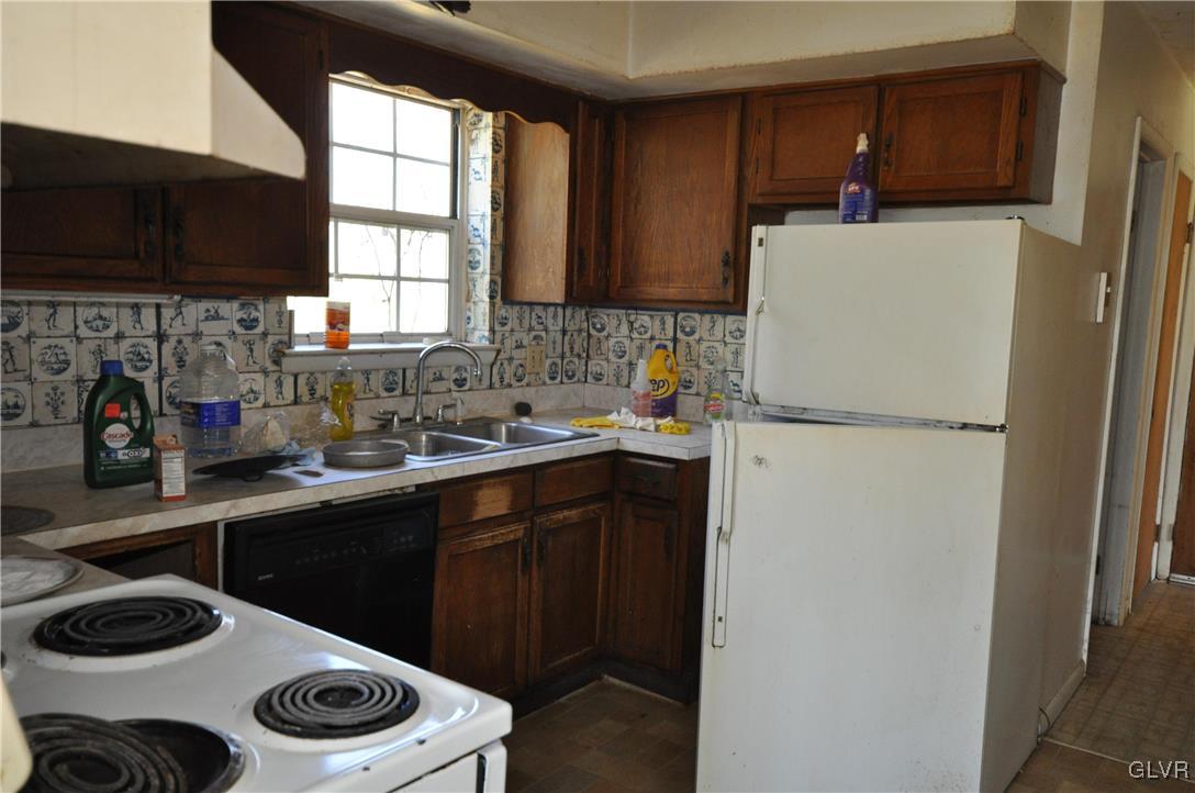 205 Longley Road Nazareth, PA 18064 - Photo 3 of 23 a kitchen with a refrigerator and a sink