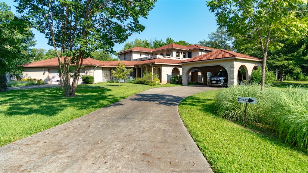 408 Rainey Street Bonham, TX 75418 - Photo 1 of 40 a front view of a house with a yard