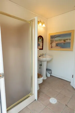 a view of a bathroom with a sink and mirror