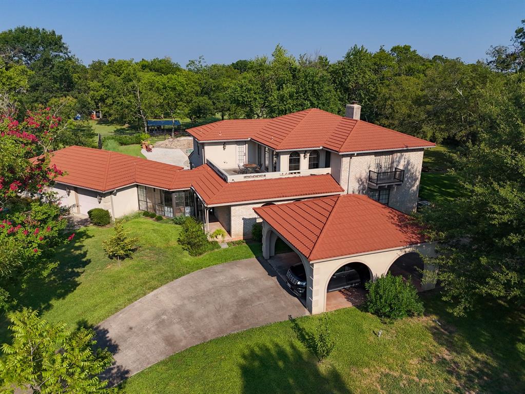 408 Rainey Street Bonham, TX 75418 - Photo 2 of 40 a aerial view of a house with yard and green space