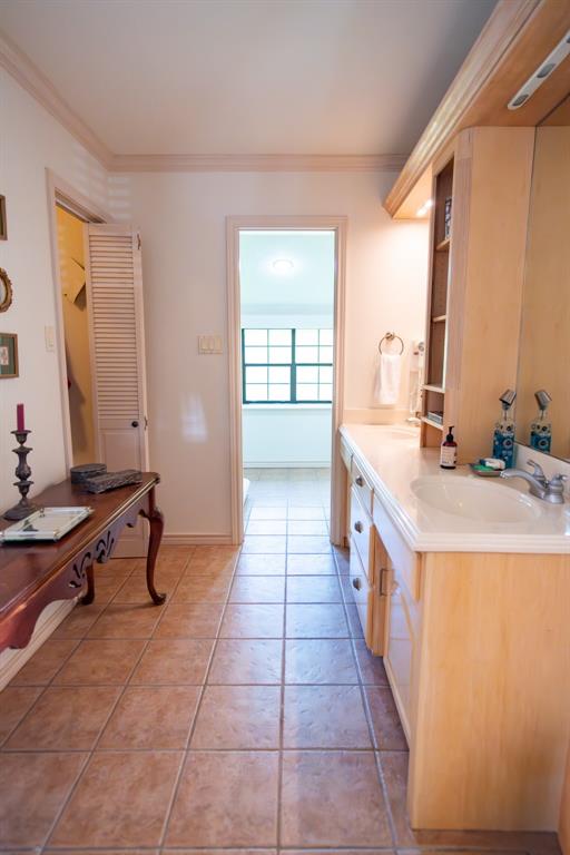 408 Rainey Street Bonham, TX 75418 - Photo 30 of 40 a bathroom with sink and mirror