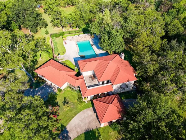 an aerial view of a house with a garden