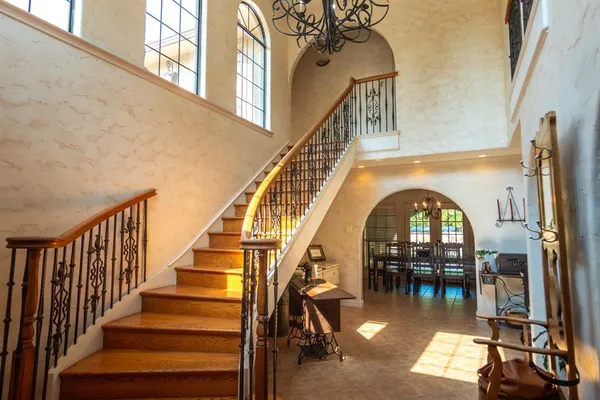 a view of entryway with dining room and wooden floor