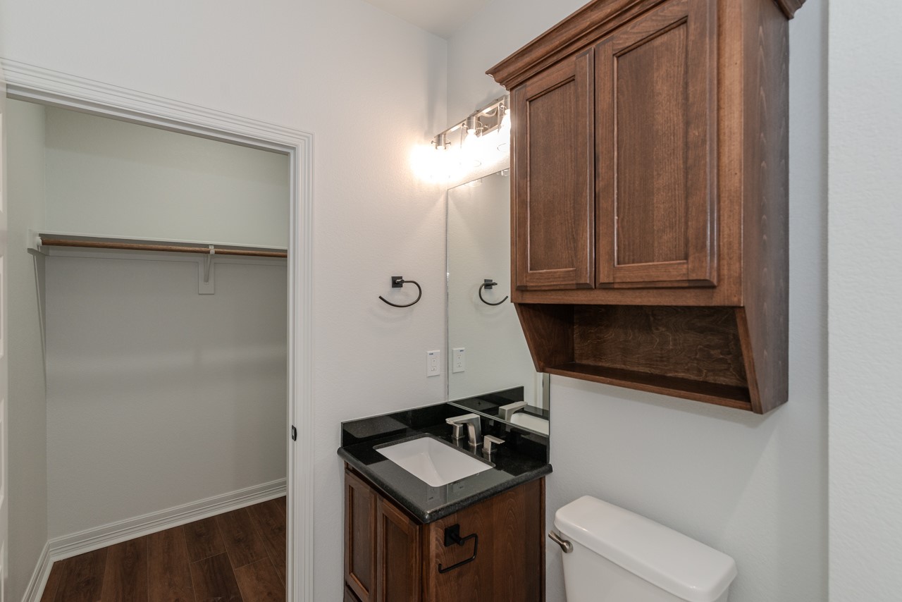 7820 Tolivar Road Beaumont, TX 77713 - Photo 13 of 47 a bathroom with a sink and a toilet