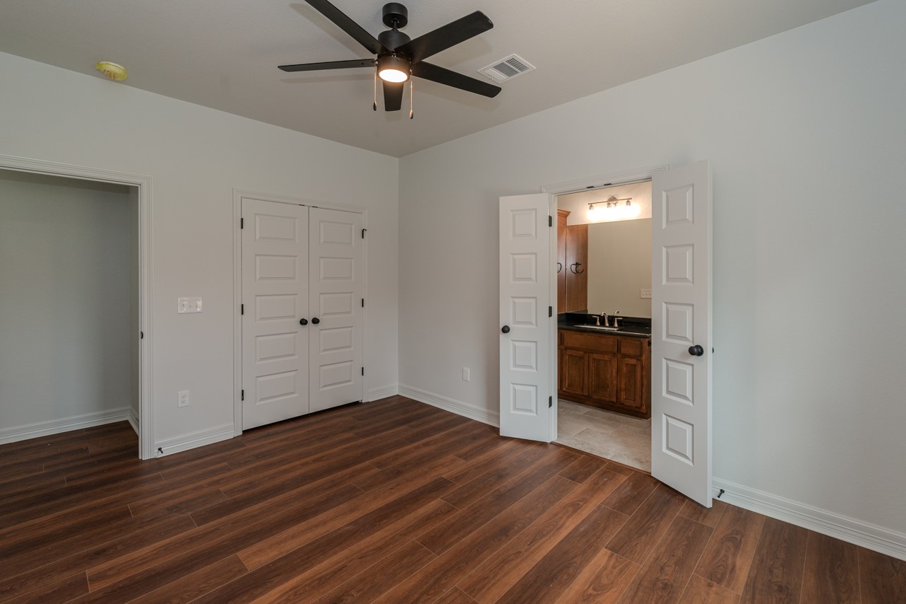 7820 Tolivar Road Beaumont, TX 77713 - Photo 28 of 47 wooden floor in an empty room with a window