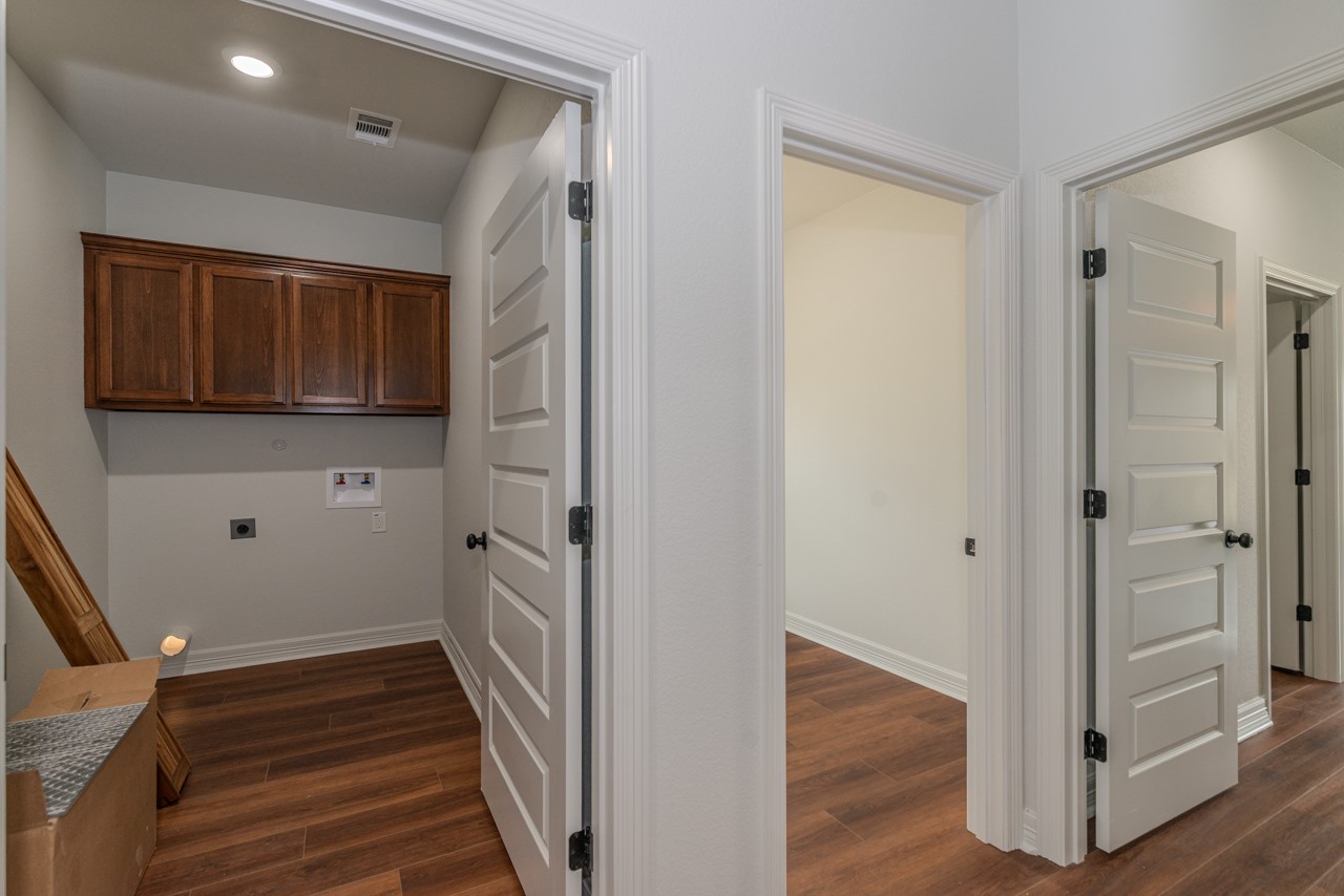 7820 Tolivar Road Beaumont, TX 77713 - Photo 31 of 47 a view of an entryway with wooden floor and cabinet